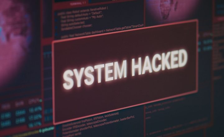 computer-monitor-showing-hacked-system-alert-message-flashing-screen-dealing-with-hacking-cyber-crime-attack-display-with-security-breach-warning-malware-threat-close-up